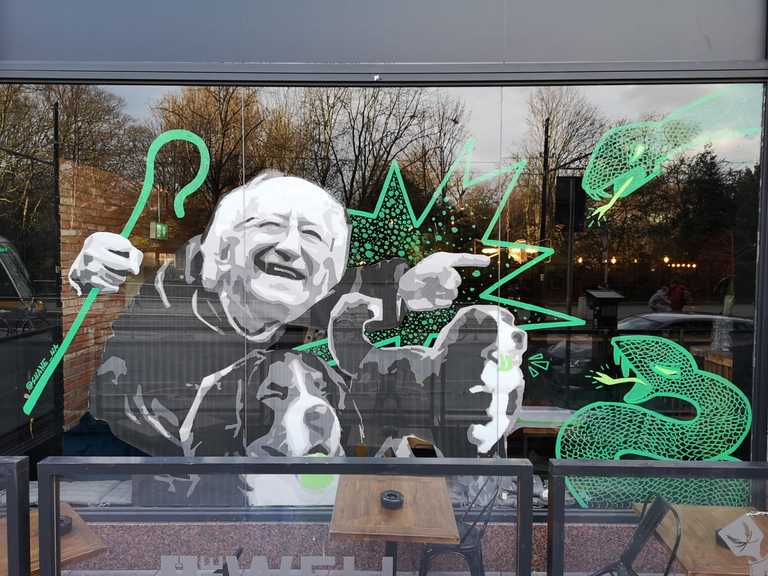 New St. Patrick’s Day mural shows President Higgins and his dogs chase out the snakes