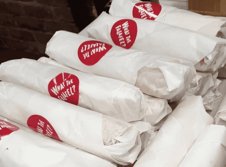 What The Falafel distributing free food to the homeless this evening