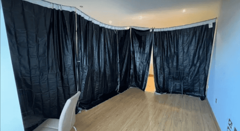 Southside property advertises ‘bedroom’ to rent with black plastic sheets instead of walls