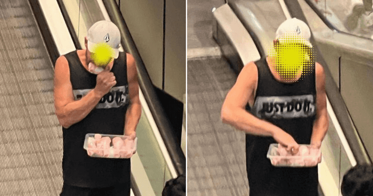 Man spotted eating raw chicken drumsticks straight out of the packet