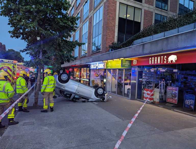 Gardaí investigating as car crashes from rooftop carpark onto Baggot Street