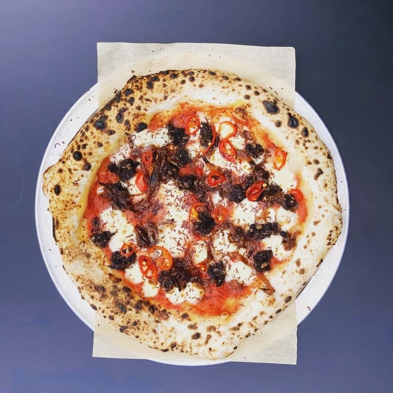Two of our fave foods become one atop this tasty pizza Two of our fave foods become one atop this tasty pizza