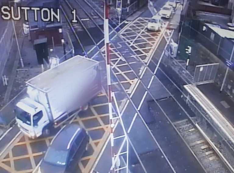 Major delays for commuters this morning after truck smashes through level crossing Major delays for commuters this morning after truck smashes through level crossing